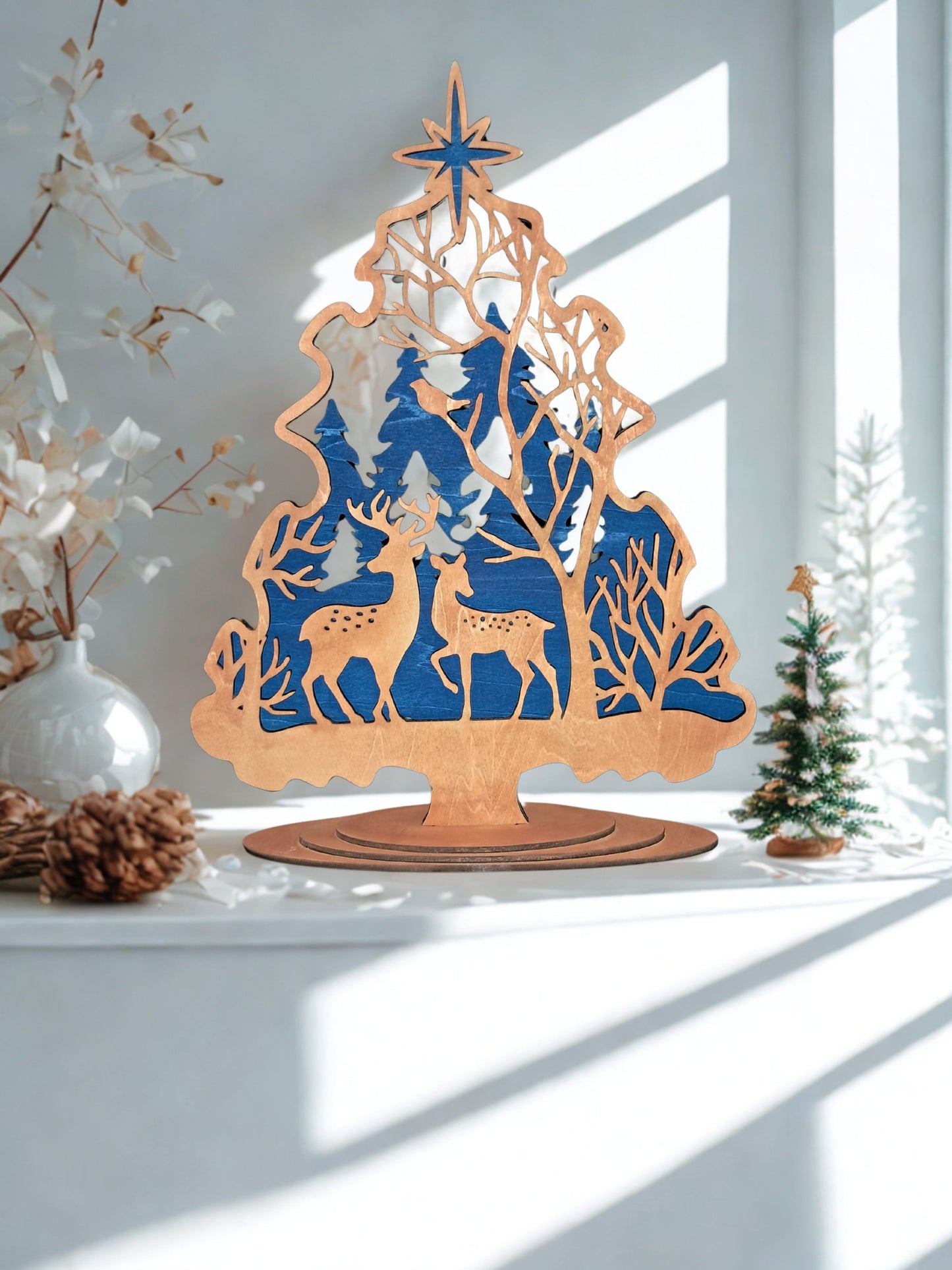 ring the beauty of nature into your home with our Beautiful Trees with Deer Decor. This charming wooden Christmas decoration is perfect for adding a touch of elegance to any space. Item measures approx. 11.50 inches high x 9 wide. Tree is removable from base so you are able to store this item flat. Please allow 5 - 7 days for processing prior to shipment as this item will be made to order. Thank you.