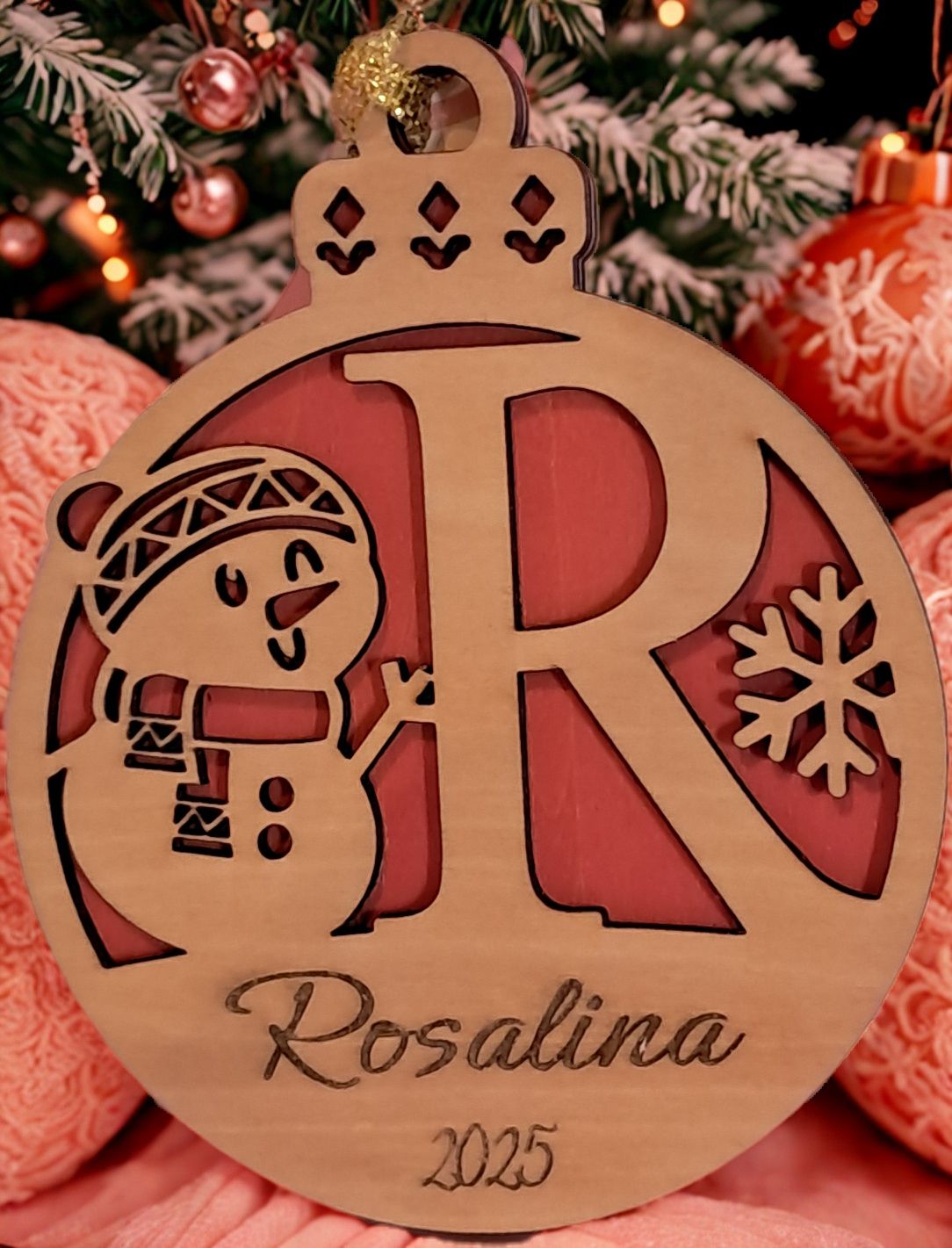 Our Personalized Snowman Christmas Ornament is the perfect gift for your loved ones this holiday season. Made of high-quality basswood, featuring personalized name and year. All letters of the alphabet are available, you may choose your background color. Ribbon hanger included. Please allow 5 -7 days for processing time as this ornament will be made to order. Thank you.
