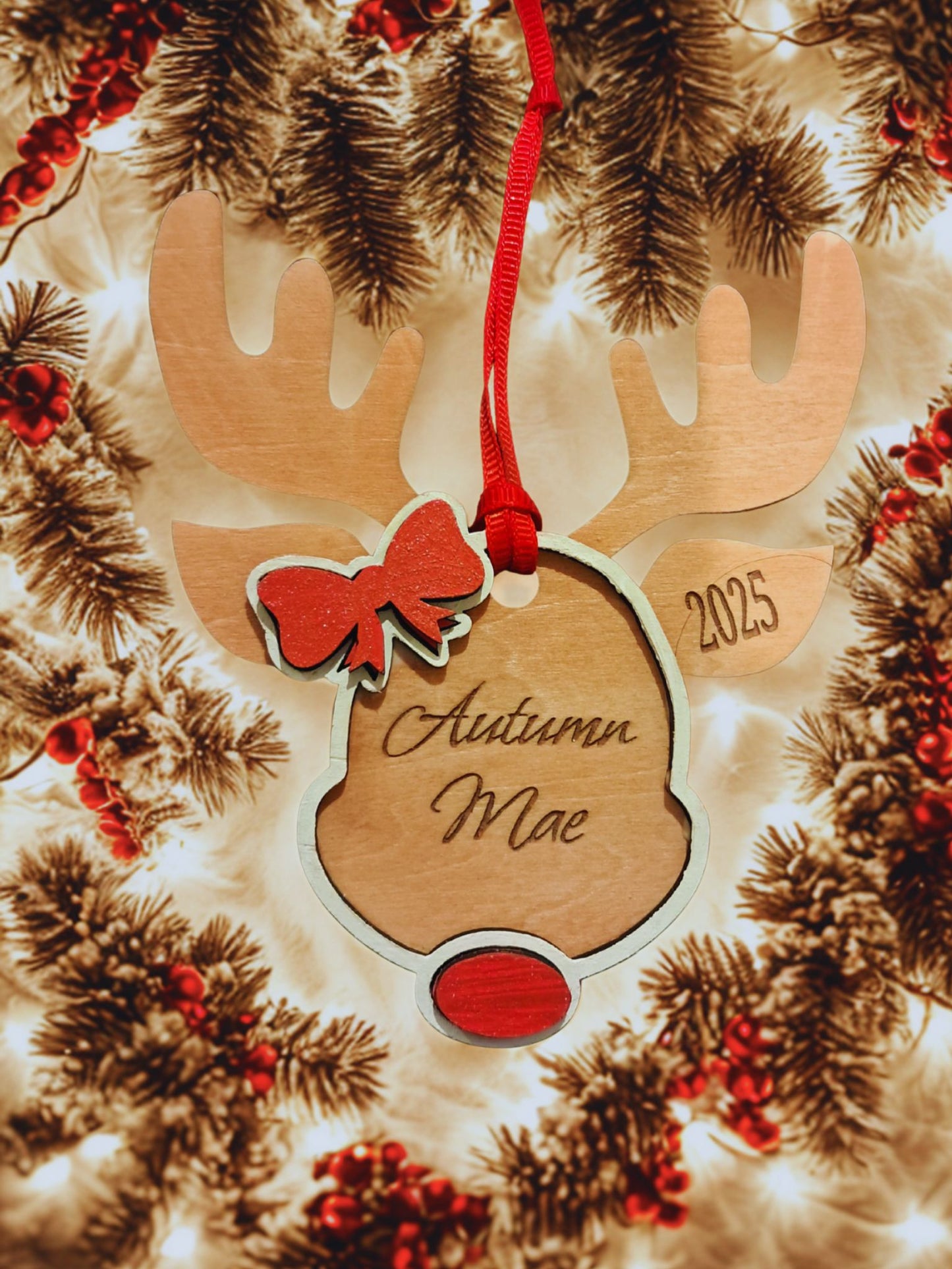 Celebrate the holiday season with our personalized Bow-deer ornament. Autumn Mae is as beautiful and as sweet as can be. Made of basswood, this charming reindeer ornament makes a thoughtful gift for all the girls on your list. Comes complete with a ribbon hanger. 
Can be customized with any name. Please allow 5 -7 days for processing time as this ornament will be made to order. Thank you. 