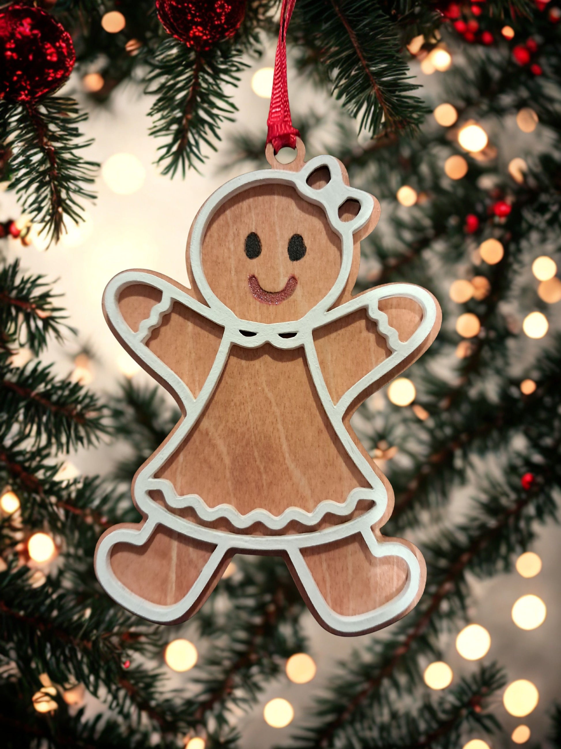 It's my pleasure to introduce you to Grace, the Gingerbread Girl. She's fun, kind, courteous, and oh so cute! She's sure to become a favorite among your beloved Christmas ornaments. We all need to give and receive a little Grace. Grace comes complete with a ribbon hanger. Ornament measures approx. 4 inches high by 2.50 inches wide. 