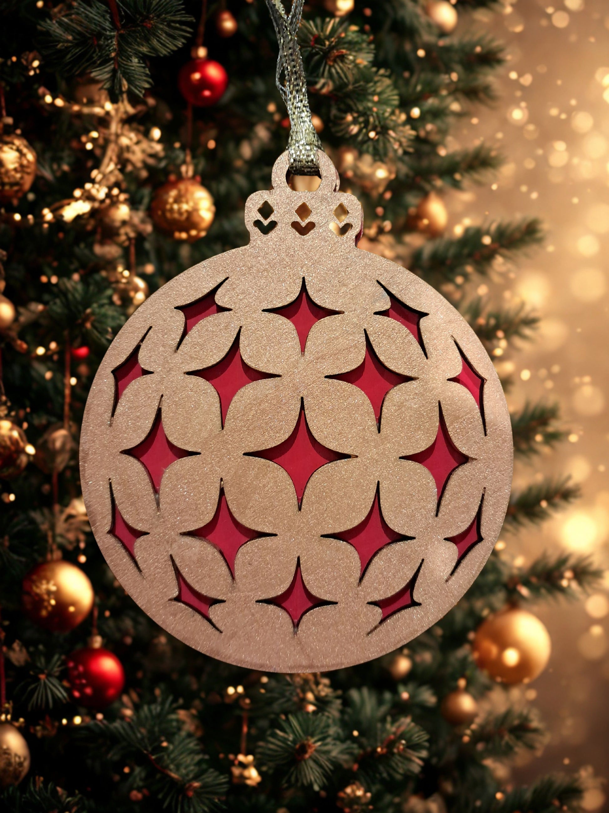Add a touch of elegance to your holiday decor with our Red and Gold ornament. Handcrafted with intricate details, this ornament is the perfect gift for loved ones or to add something festive to your own tree. Ornament comes with a ribbon hanger and measures approximately 3.50 inches wide. Please note: This ornament is made up of 2 layers of basswood and is a flat ornament. 